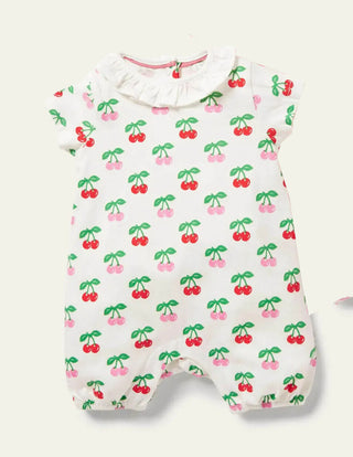 Baby Boden Short Sleeve Frilly Neck Printed Romper in Ivory/Cherries