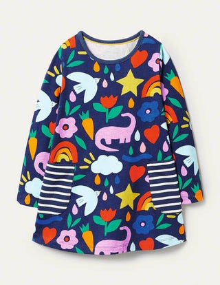 Mini Boden Girl's Printed Jersey Pocket Tunic in Starboard Blue Happy Dino